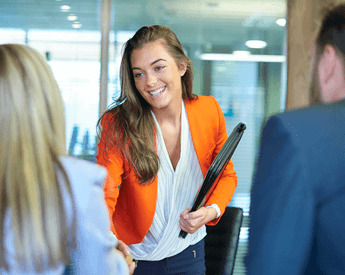 University Impact | Young woman comes into an interview | THINK Education
