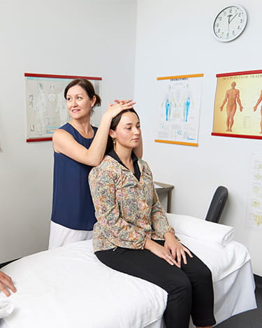 Myotherapy Courses and Degrees | Think Education | Woman Stretching Patient | Large