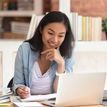 Find a Course | THINK Education | Woman on Laptop | Large