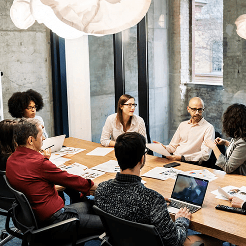 Governance and Leadership | Governing Board | Colleagues at a table | Medium