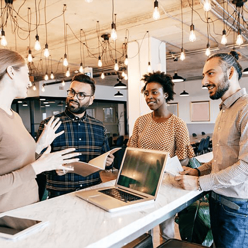 Our Impact | Four People Working Together | Think Education | Medium