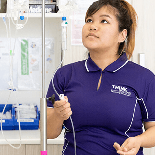 nursing student adjusting fluids