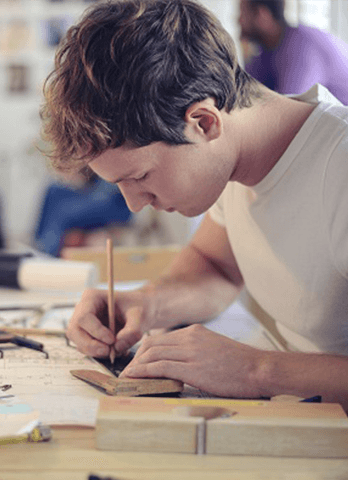 Industry Scholarships | Man Drafting at Work | Think Education